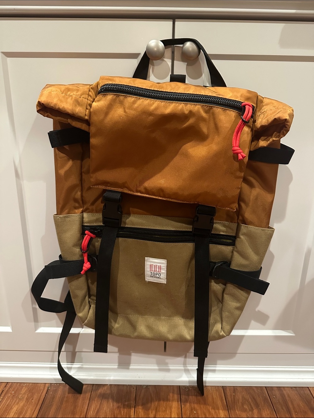 Topo Designs Two-Tone Roll Top Backpack in Rust and Tan with Red Accents